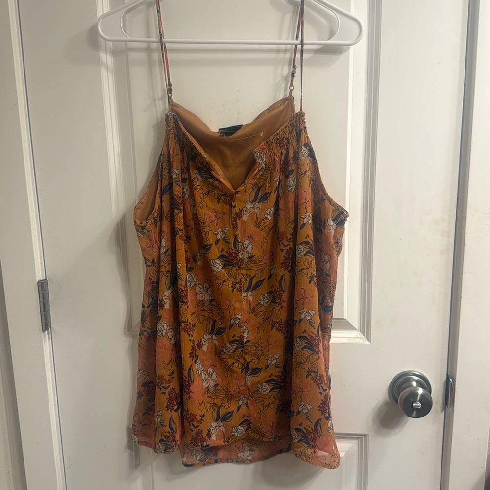 A brand new Buckle tank top, size Large, featuring adjustable straps.